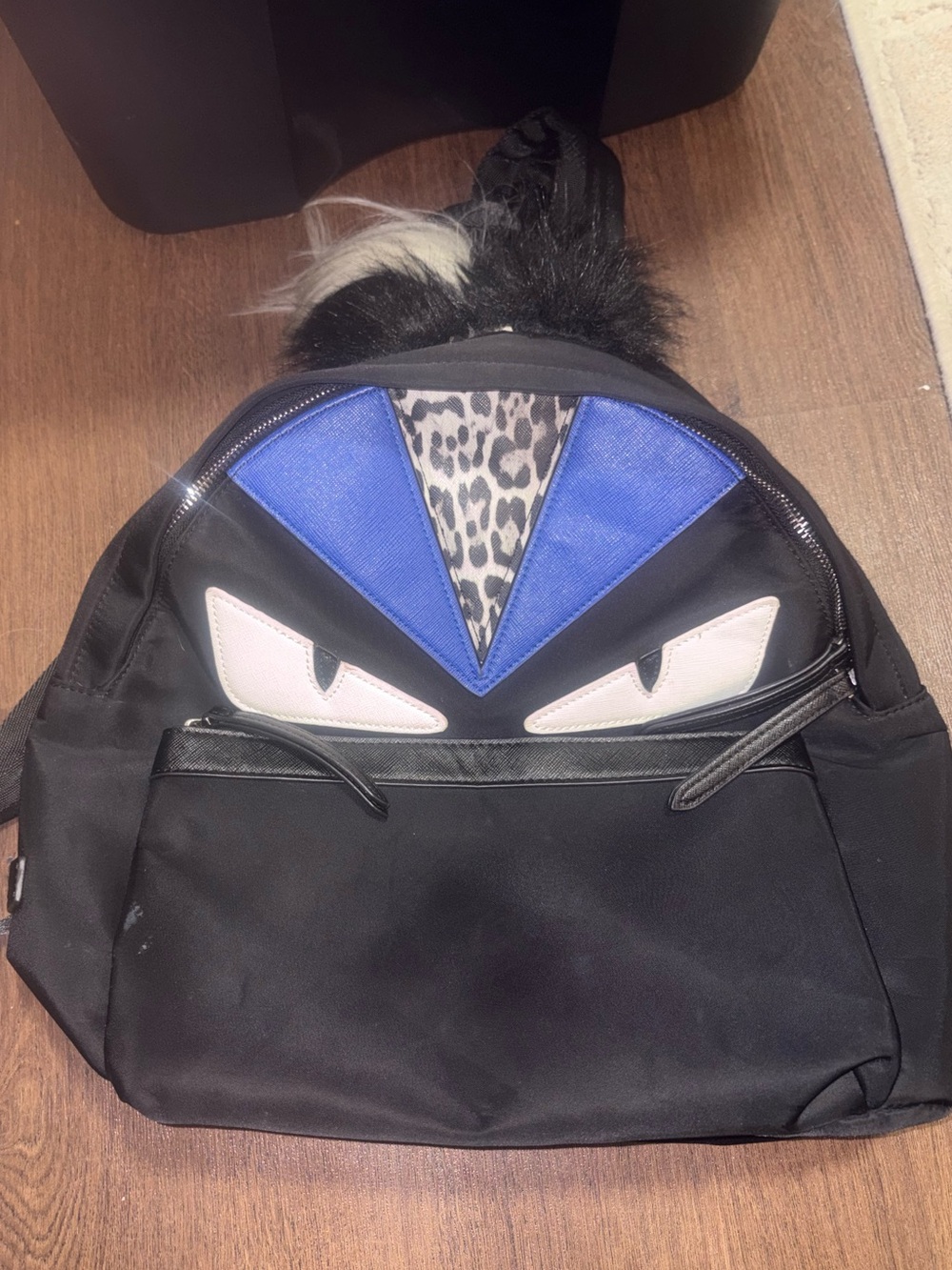 Black Men's Backpack with Blue Accent and Leopard Detail